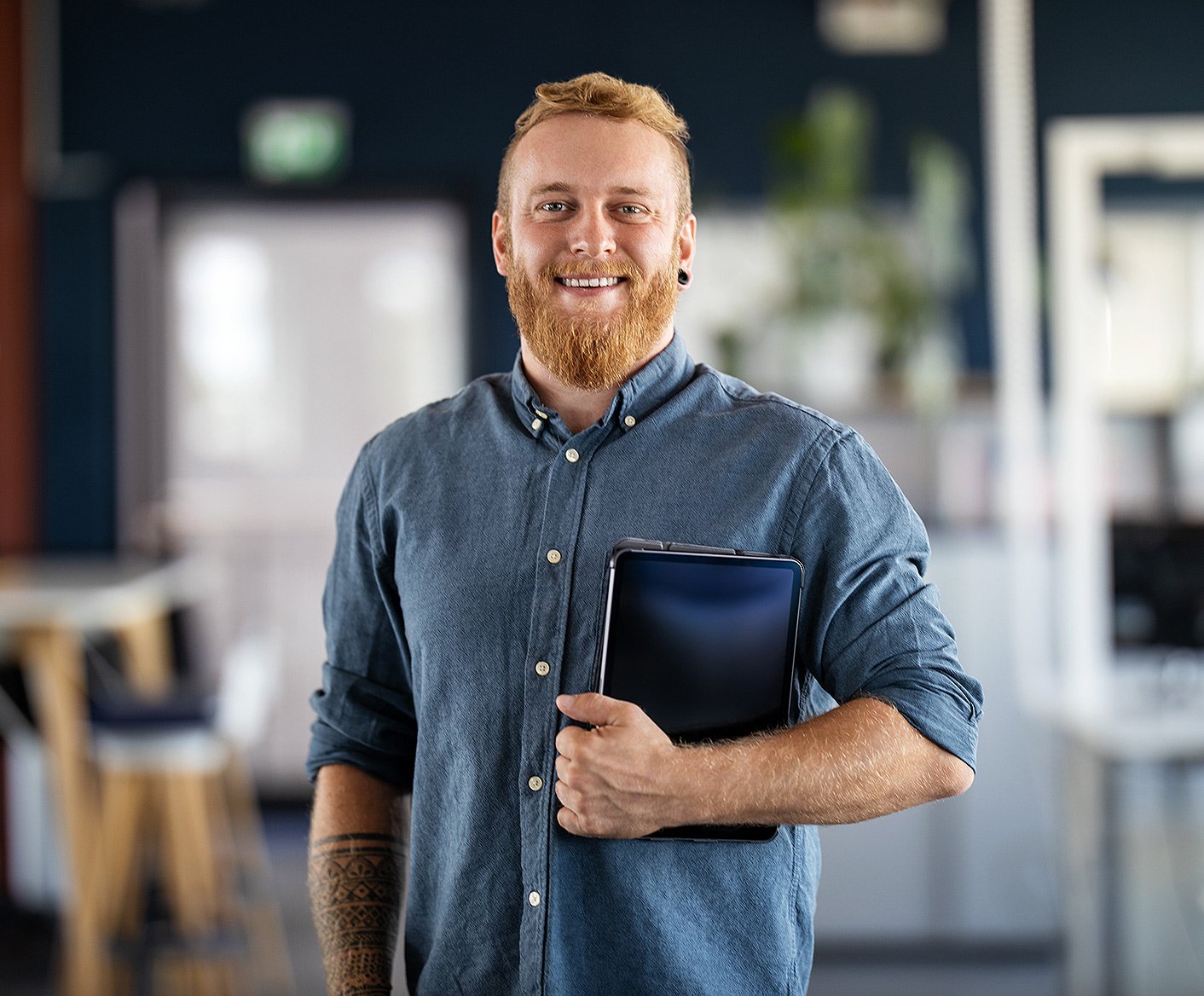 Technical-guy-happy-with-tablet-under-arm